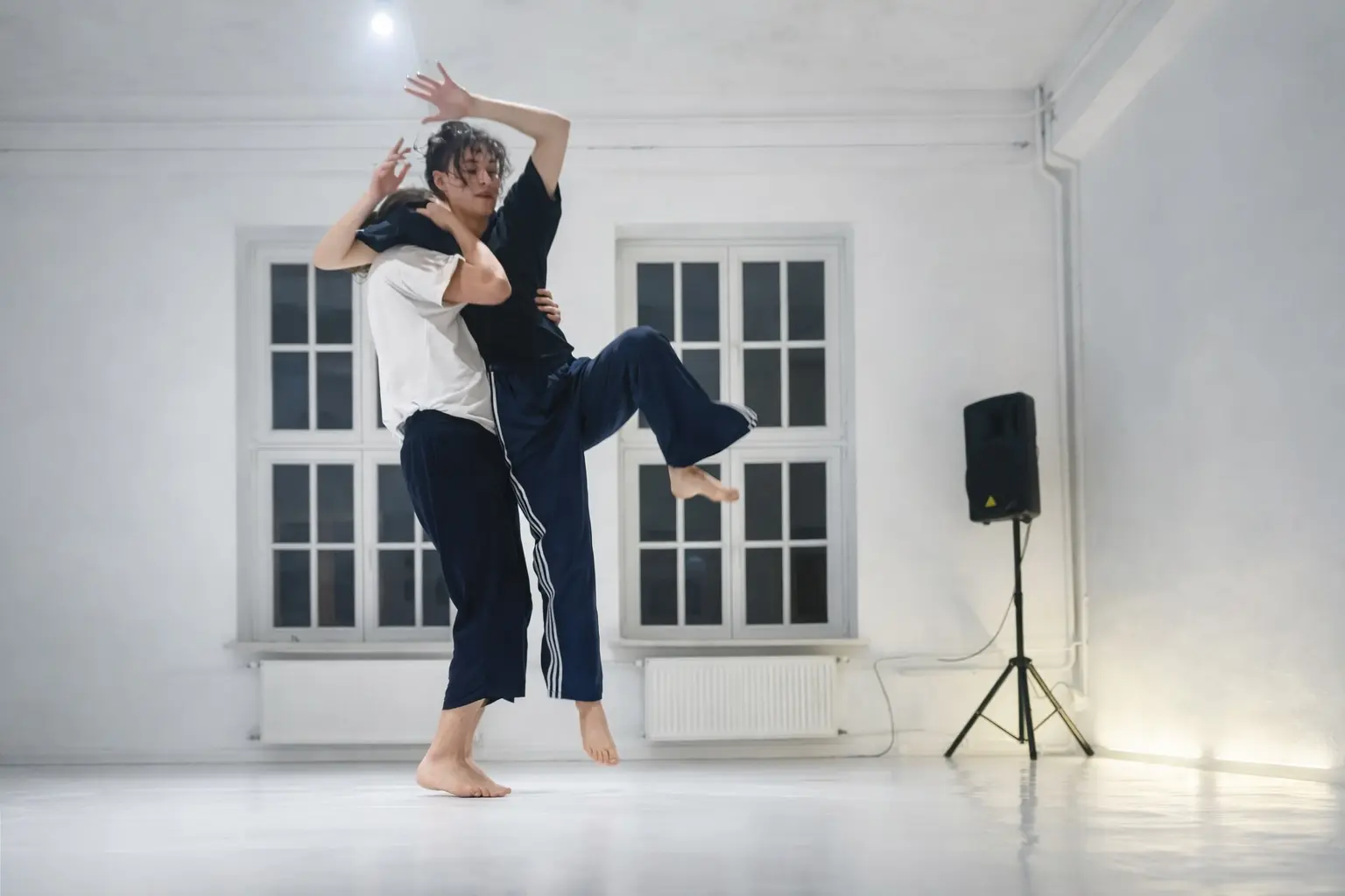 Contactish dancers moving with shared momentum